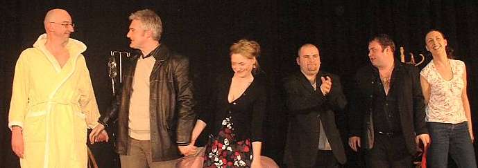 The cast take a curtain call